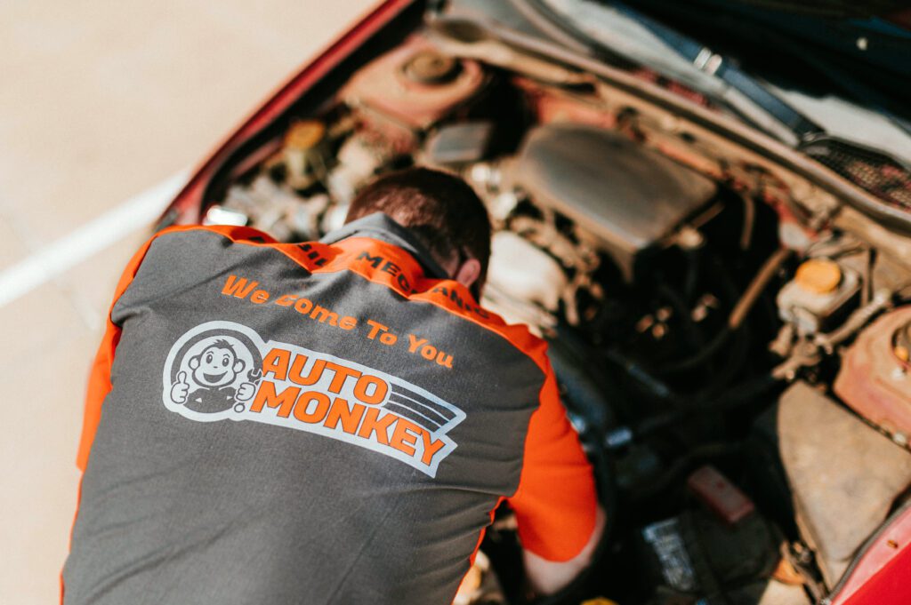 Mobile Mechanic checking the engine and fluid levels