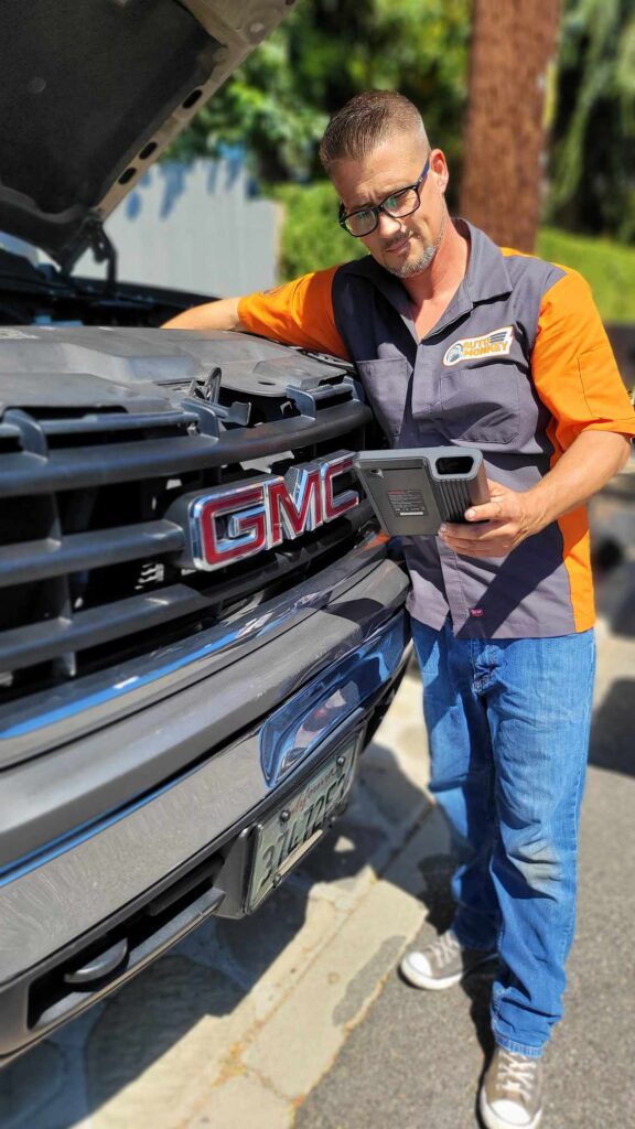 Mobile Mechanic performing diagnostic services