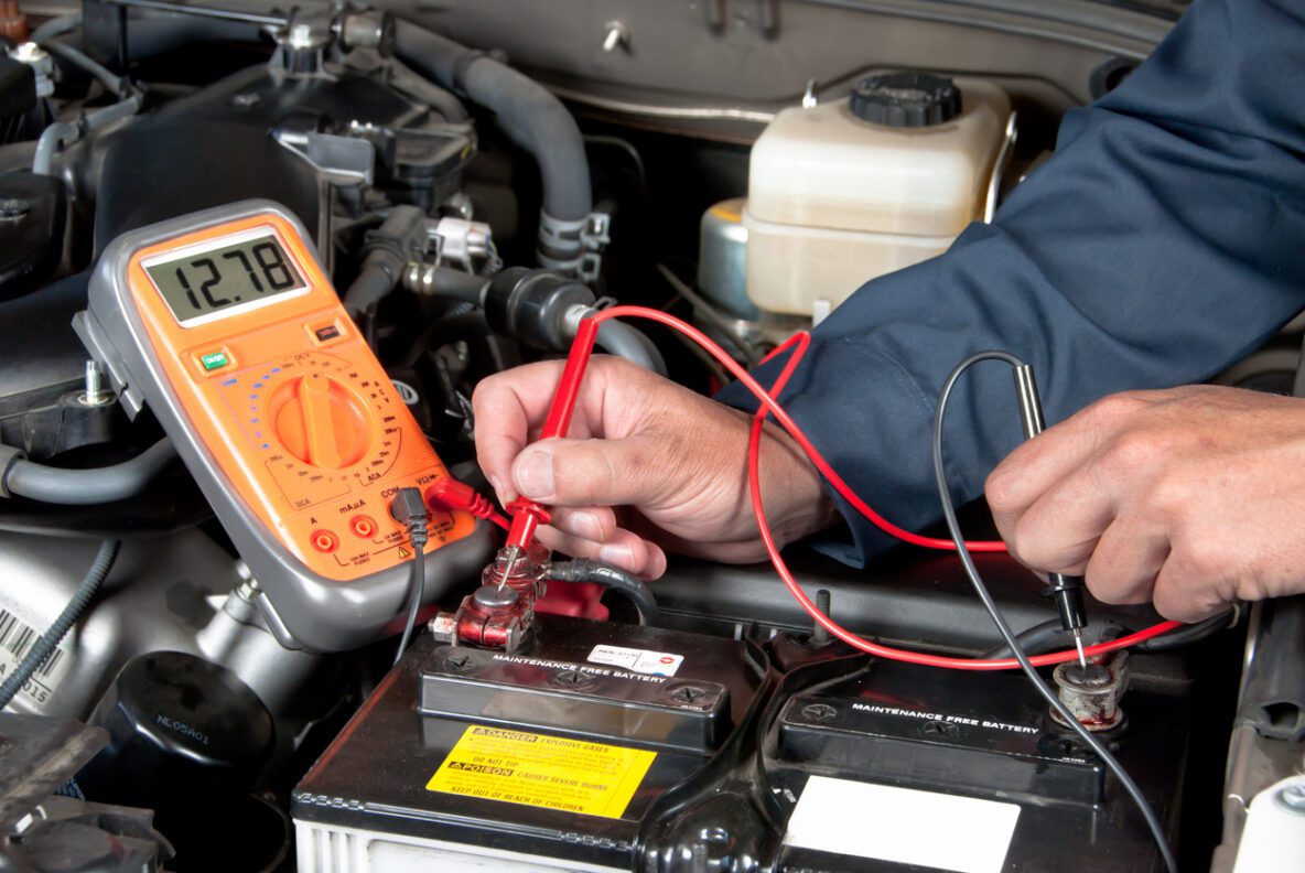 mobile mechanic testing a battery